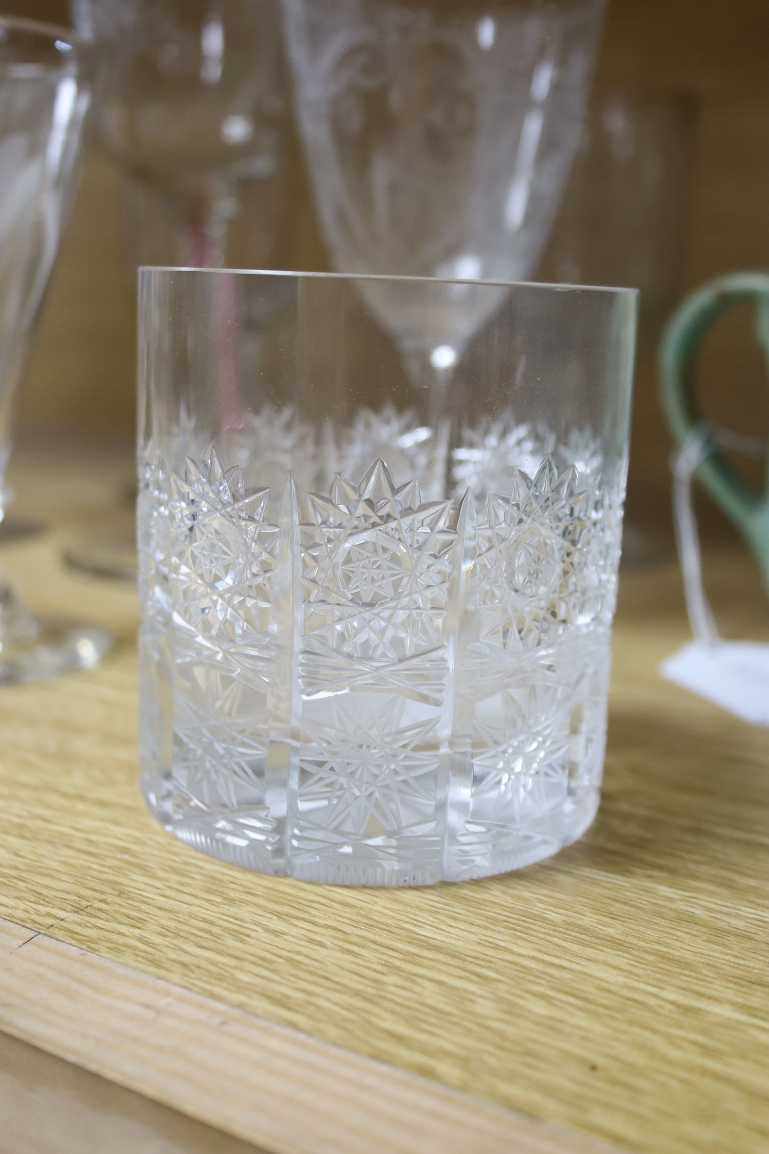 A collection of nine assorted antique etched and cut drinking glasses, tallest 22cm